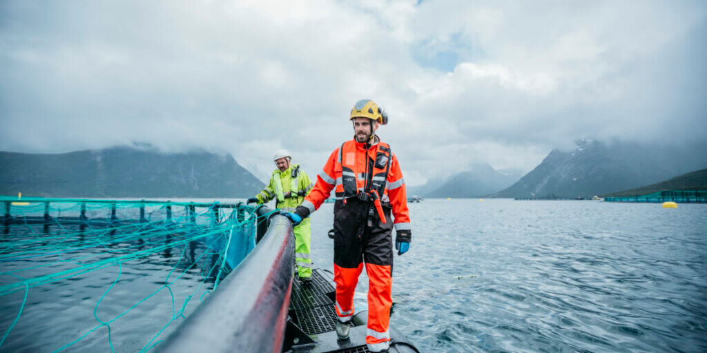 Cermaq worker at fishfarm out at sea in Norway