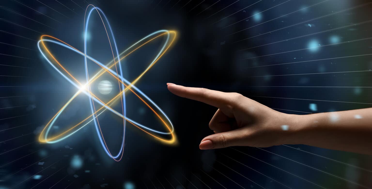 A finger reaches to touch a spinning atom