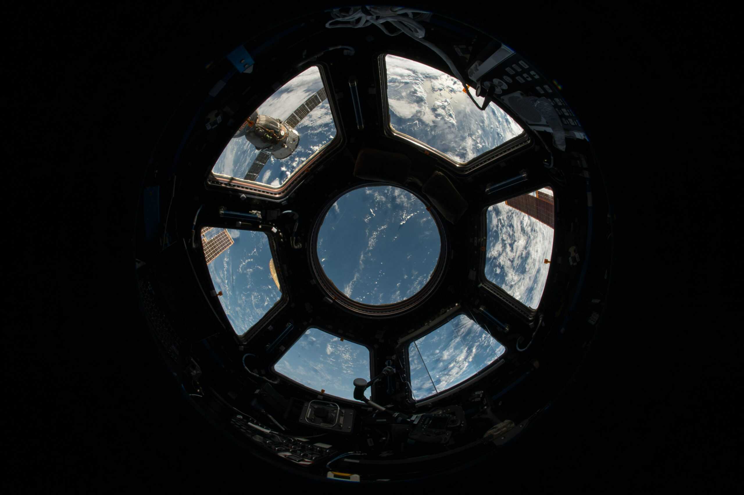 Photo shows image of earth from inside a satellite.