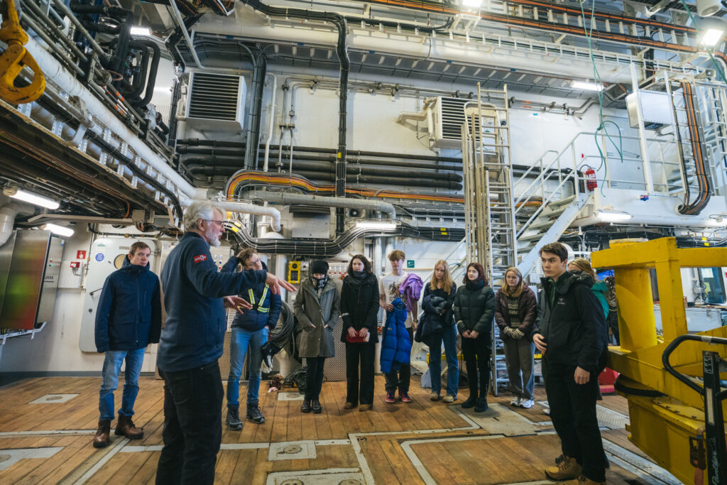Image shows students on a tour of a research vessel.