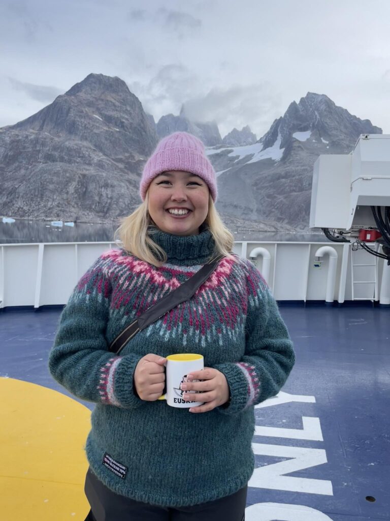 Picture of a young woman on a ship.