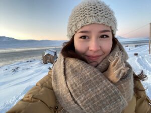 Ciera Lee-Kooneeliusie (she/her) was born and raised in Qikiqtarjuaq and Panniqtuuq, NU. She grew up intertwined in and aware of a rapidly evolving landscape, both in our physical environment and epistemology. Her parents, both passionate educators, skilled hunters and navigators, supported her placement between the Euro-Canadian world and their traditional world – this provided her with the footing to support where she is today. Her career with the Canadian Coast Guard’s Arctic Region began in 2018, when she worked as a Search and Rescue (SAR) Crew member with the newly developed Inshore Rescue Boat Program in the Arctic. Since then, her career with the Canadian Coast Guard (CCG) has continued to develop as she has taken on various positions with increasing ability to enact change in how the program is established specifically for the Arctic.