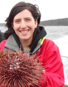 Lauren Wiesebron (she/her) is a PhD candidate at the Netherlands Institute for Sea Research where she is researching how sediment dynamics drive the establishment and survival of intertidal benthic communities. However, her scientific curiosity does not stop at the intertidal and she has studied a diverse number of topics, including trophic dynamics in Patagonian forage fish, salmon migration, and nutrient cycling in Arctic Alaska. This past summer, she investigated patterns in seaweed cover on rocky beaches in Svalbard. She is American and Dutch and grew up in France. When she is not having scientific adventures in the field or behind the computer, she enjoys hiking, weaving, and reading her constantly growing pile of books.