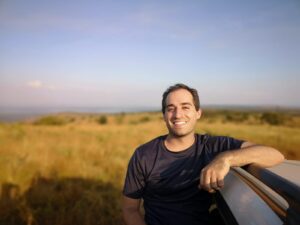 Bryan Cassella (he/him) is the Regional Disaster Officer for the American Red Cross of Alaska. He comes to this position by way of an academic and professional career in international development and humanitarian aid. Having lived and worked around the world, most extensively in Mongolia, Sri Lanka, and Rwanda, his experiences have embedded a deep passion for and care of community engagement, exchange, and empowerment. In relocating back to the United States, he sought to make Alaska his home, as it possesses such a vast and under-appreciated wealth of history, culture, diversity, resilience, and independence. While in graduate school, he discovered some of his greatest academic interests revolved around movements for self-determination and transitional justice. Through the combination of these two themes, he sought to decolonize his understandings of social motivations and reconstruct his approach and methods in engaging communities where they are at, with the tools and wisdoms most available and comfortable to them. He has found great appreciation and value for the state he lives in, for there is much to learn from the ways of its native communities and even more to cherish from the pride Alaskans maintain. Through extensive travel across this vast state, he has seen first-hand the devastating impacts of climate change on Arctic and Sub-Arctic communities. Now more than ever he is driven to foster new connections between Arctic communities, support the people of his home state in their evolution of modern resiliency strategies, and find new paths for resources that may deliver hope for a sustainable future while preserving a historic past. The opportunity for advocacy and privileges granted by his position are the greatest tools at his disposal as we all seek to identify the most effective course of action for unprecedented development in the global Arctic.
