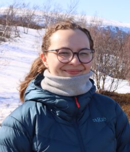 Anna Bolle is a Sustainability Officer currently based in the Arctic, where she works at the intersection of mineral exploration and community engagement. Originally from Ballangen in Nordland, Northern Norway, Anna brings an understanding of cultural landscapes and ecological systems to her role. She holds a Master’s degree in Anthropology and Archaeology from the University of Aberdeen, where she developed a strong foundation in human-environment relations and heritage preservation. Her academic background, combined with field experience across Northern regions, informs her approach to sustainable development in sensitive and remote areas. Anna is particularly passionate about integrating local knowledge into project planning and ensuring that sustainability initiatives respect both cultural traditions and ecological integrity. Her work often involves collaboration with Indigenous communities, researchers, and industry partners to promote responsible practices in Arctic development.