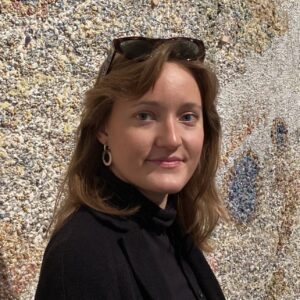 Tuva Mossin is an art historian and critic educated at the University of Bergen (UiB), where she is currently a PhD candidate in art history. Her research focuses on the visual history of ideas from the Enlightenment to the present, with a particular interest in artistic practices at the intersection of art and activism.  In her PhD project, Mossin investigates how Greenland and its people have been represented in Norwegian imagery from the mid-1600s to the present day. By tracing these depictions across painting, photography, film and other objects in museum collections, her research highlights how colonial perspectives have shaped ideas of the Arctic in general, and how such imagery continues to influence perceptions of Greenland specifically.  Alongside her academic work, Mossin has extensive practical experience from the museum field, including curatorial collaborations and public dissemination projects. She also writes regularly as an art critic for Kunstkritikk.no.