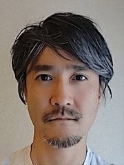 Arctic Frontiers - A man with short, wavy, salt-and-pepper hair and a goatee looks directly at the camera against a plain background.