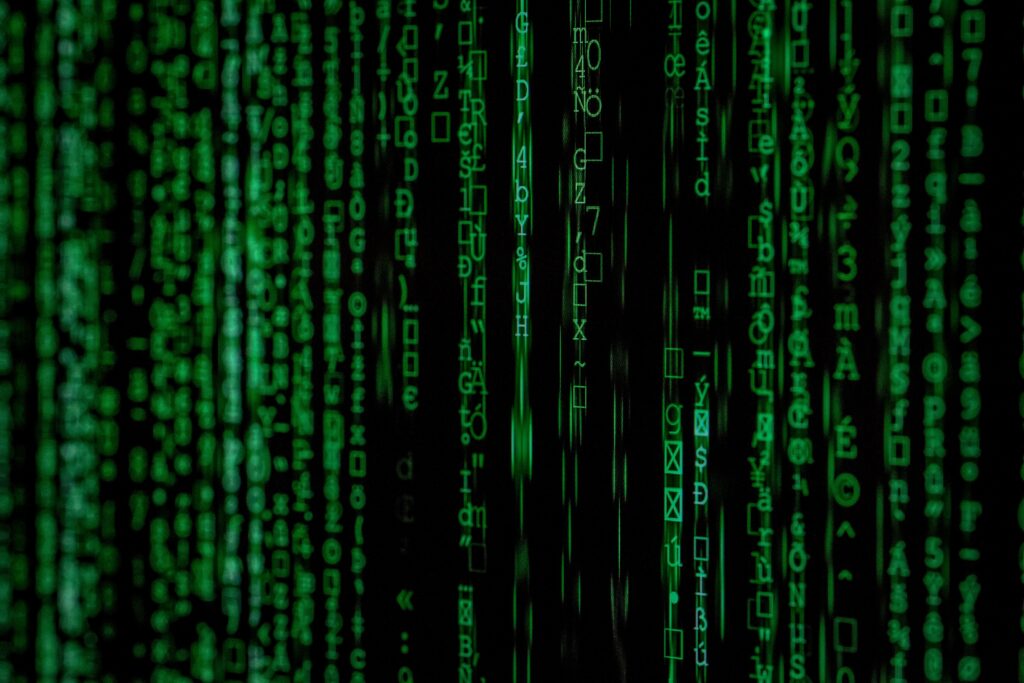 Arctic Frontiers - Columns of glowing green EU digital code and symbols falling against a black background.
